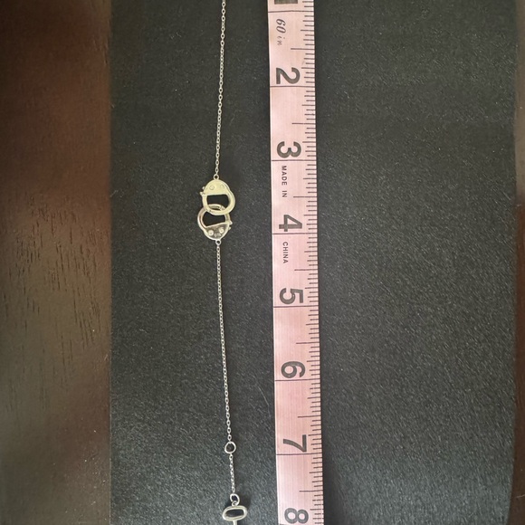 Elegant Silver Key and Handcuffs Bracelet - Picture 2 of 4